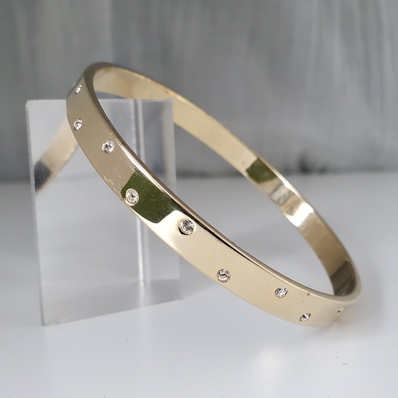 Swarovski Jewelry - Swarovski Flat Goldtone Bangle w/Random Crystals